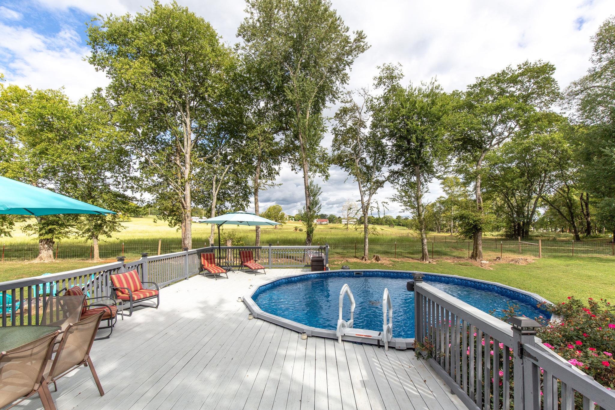 1207 Maple Hill Road Lebanon, TN 37087 - Photo 26 of 29 a view of a swimming pool with a deck and furniture