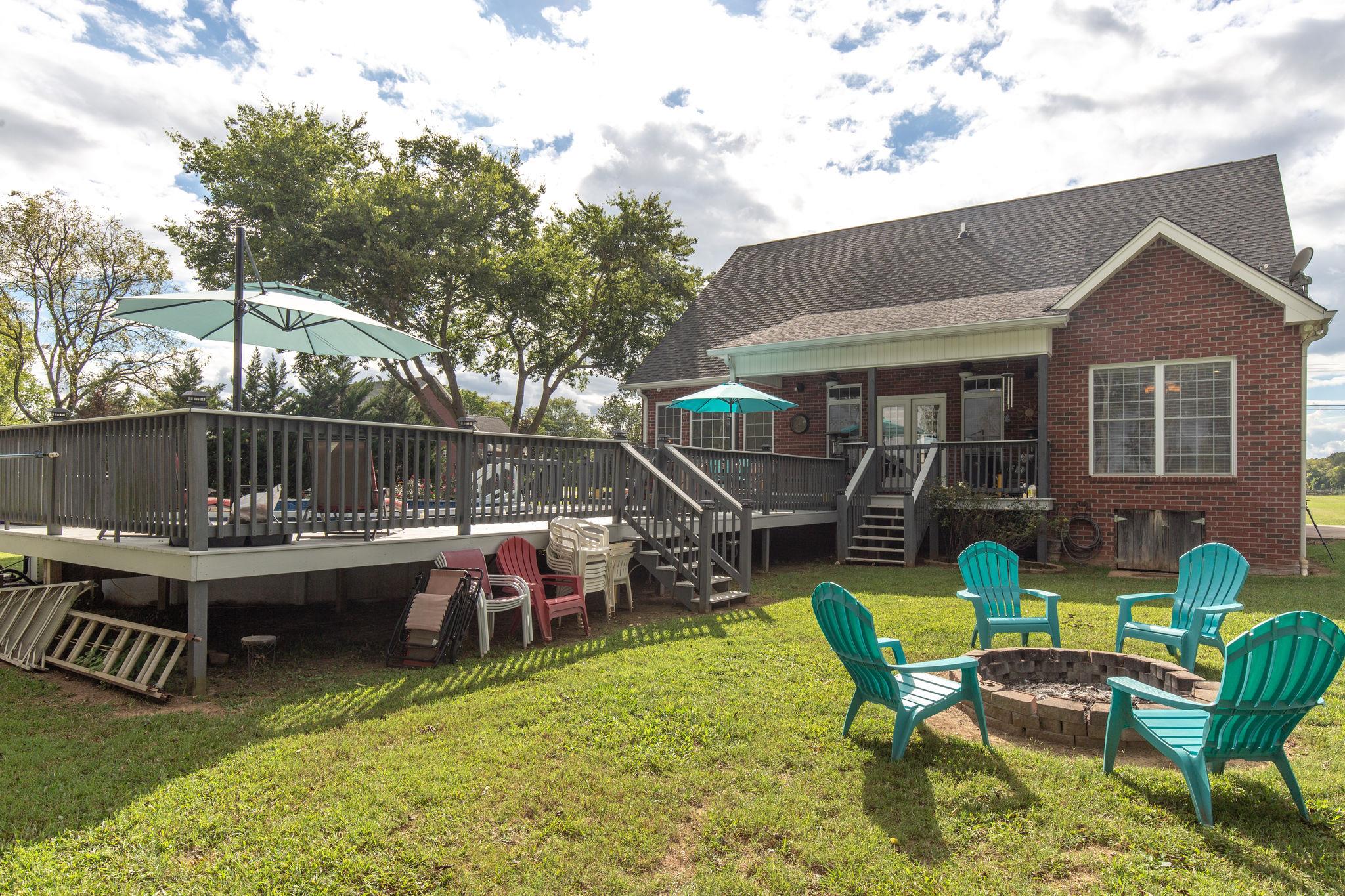 1207 Maple Hill Road Lebanon, TN 37087 - Photo 27 of 29 a view of a patio with a table chairs and a table