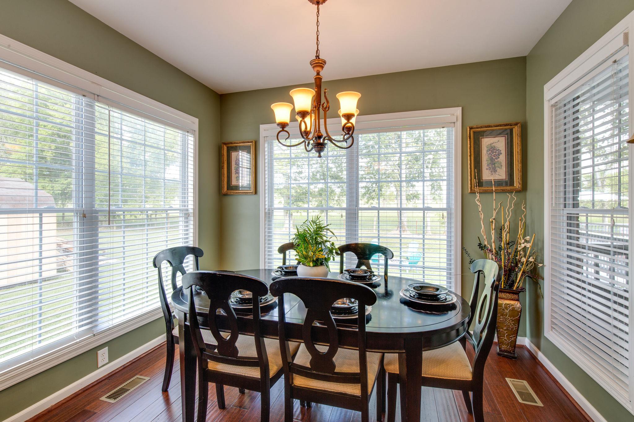 1207 Maple Hill Road Lebanon, TN 37087 - Photo 8 of 29 a view of a dining room with furniture and windows