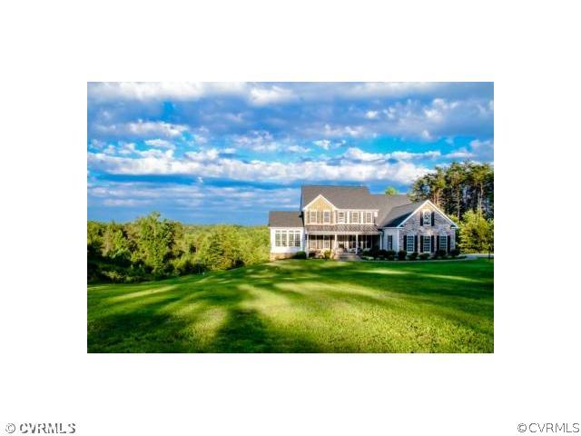 1175 Lickinghole Road Goochland, VA 23063 - Photo 1 of 24 a view of a big garden with a building in the background
