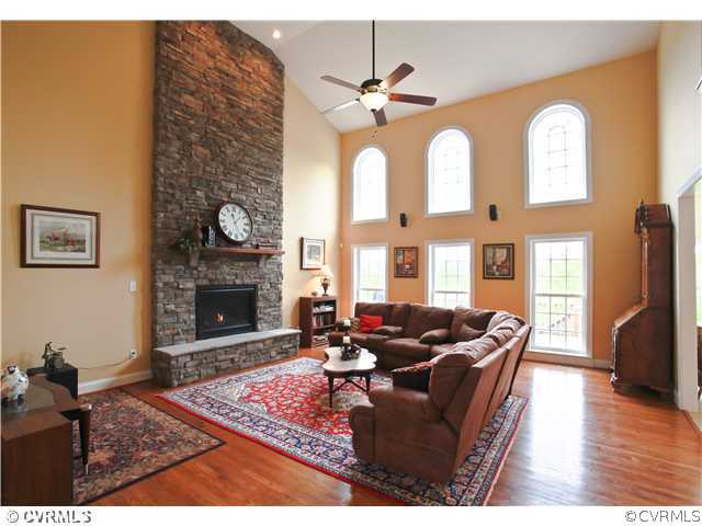 1175 Lickinghole Road Goochland, VA 23063 - Photo 5 of 24 a living room with furniture a fireplace and a flat screen tv