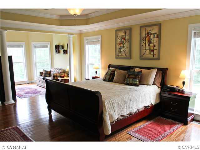 1175 Lickinghole Road Goochland, VA 23063 - Photo 9 of 24 a bedroom with a bed and wooden floor