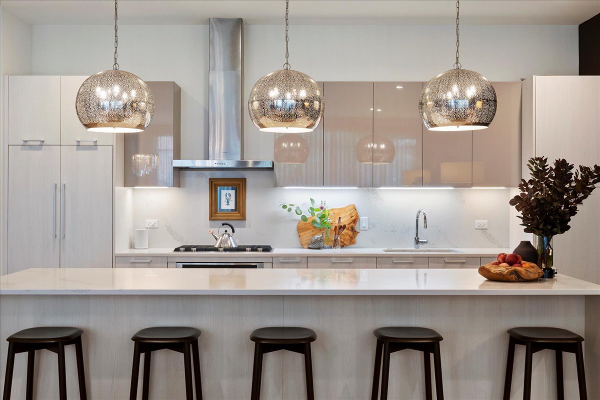 36 North Carpenter Street, Unit 2N Chicago, IL 60607 - Photo 11 of 26 a kitchen with a table and chandelier