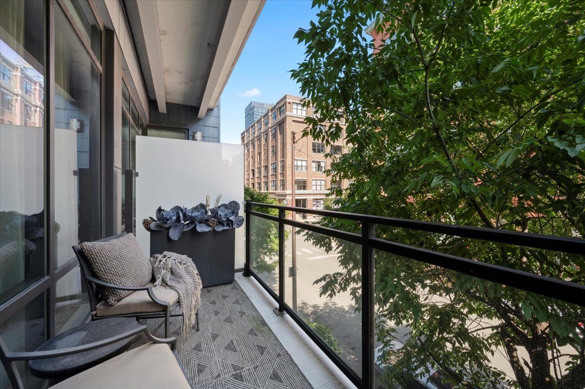 36 North Carpenter Street, Unit 2N Chicago, IL 60607 - Photo 14 of 26 a balcony with chairs and an outdoor view