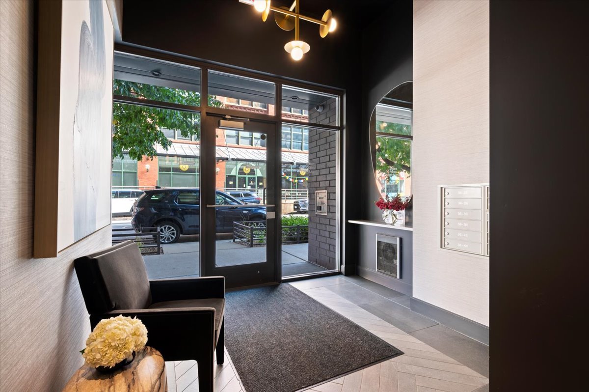 36 North Carpenter Street, Unit 2N Chicago, IL 60607 - Photo 2 of 26 a living room with furniture and wooden floor