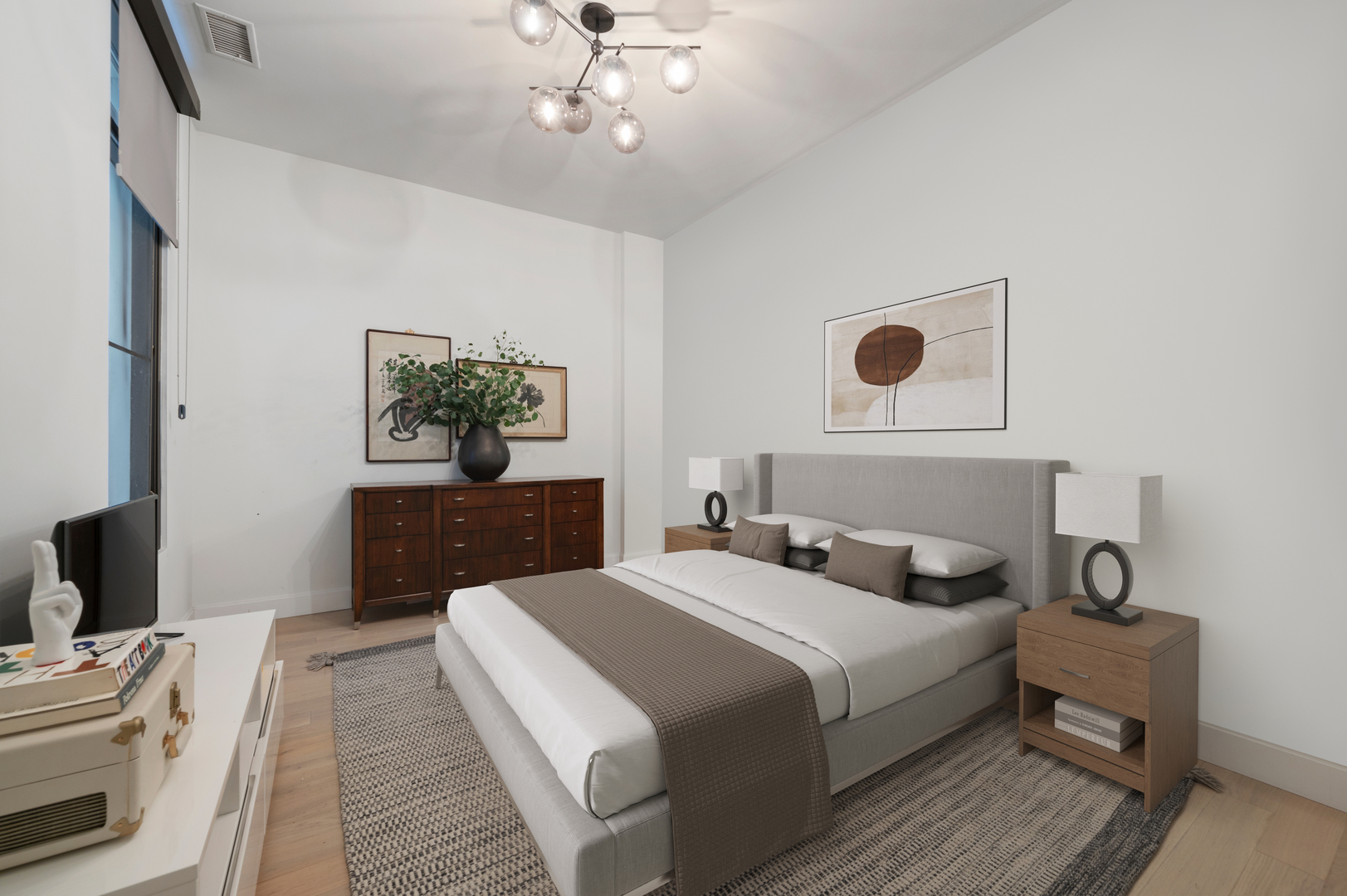 36 North Carpenter Street, Unit 2N Chicago, IL 60607 - Photo 22 of 26 a bedroom with a bed and a chandelier