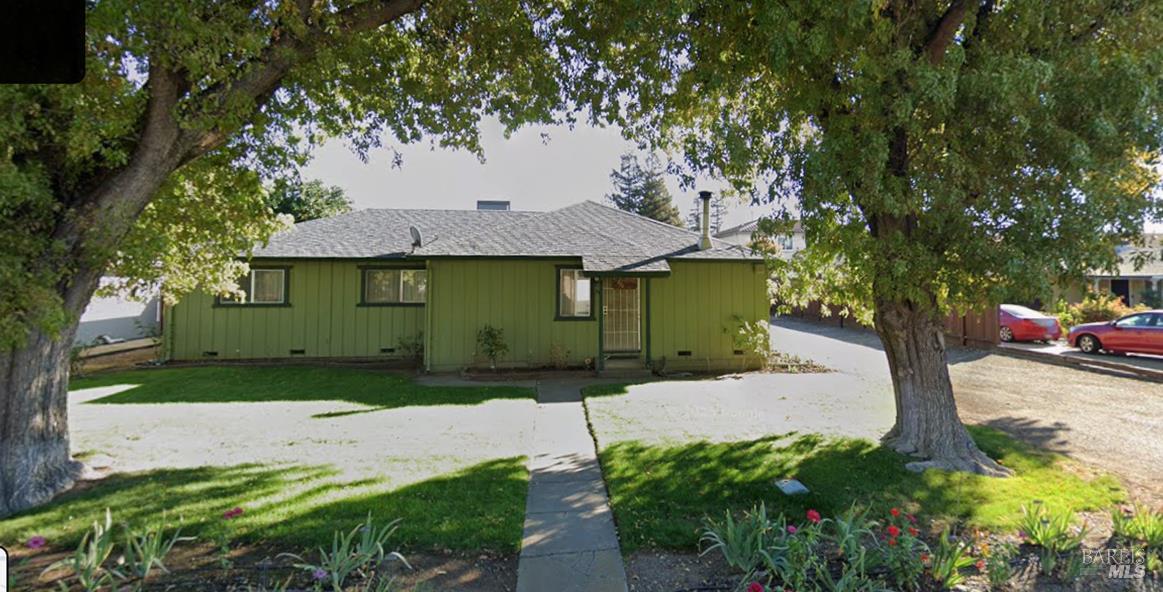 324 Hamilton Drive Fairfield, CA 94533 - Photo 1 of 1 a front view of a house with a garden and trees