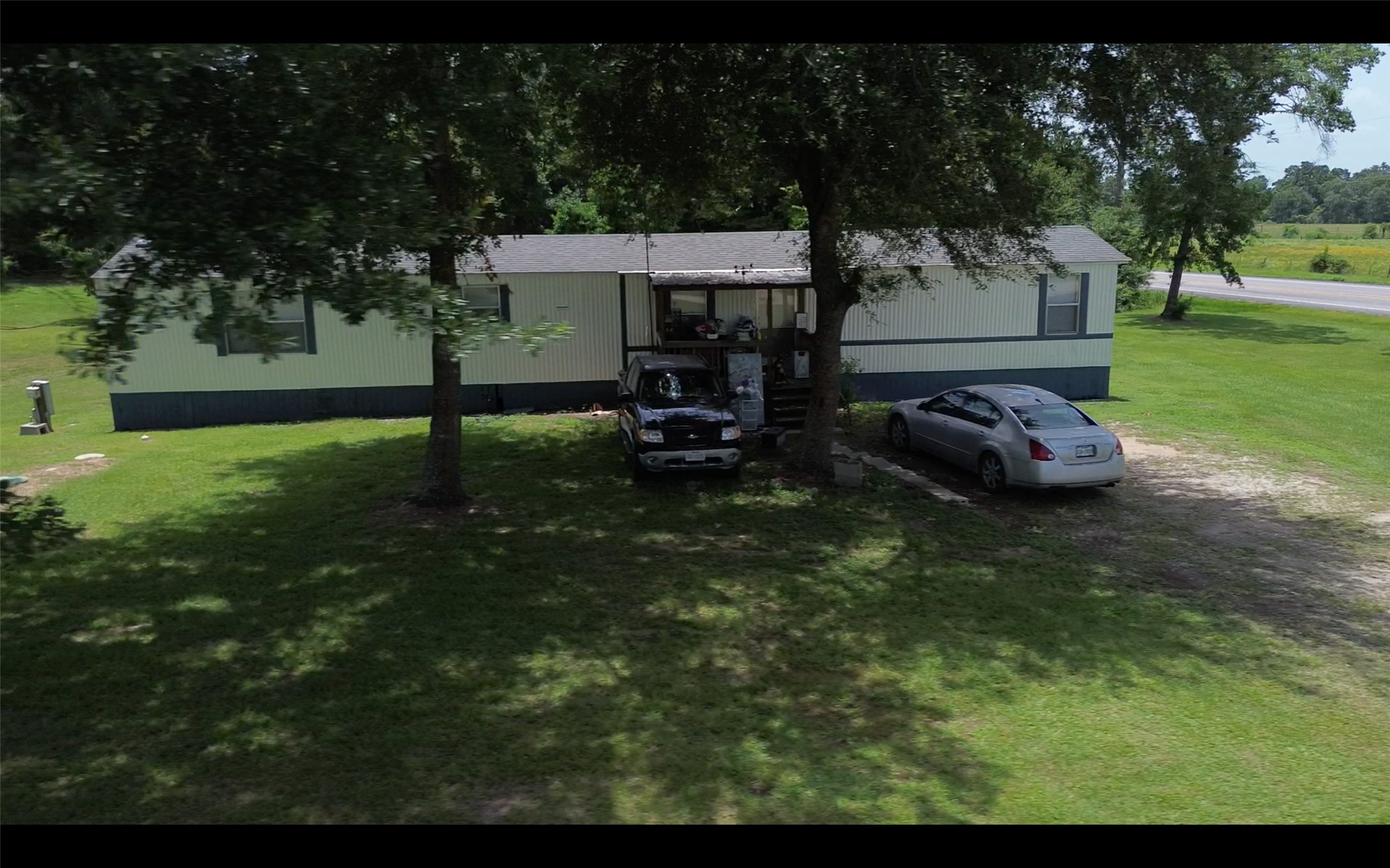 24106 Farm To Market 362 Waller, TX 77484 - Photo 13 of 41 a backyard of a house with barbeque oven table and chairs