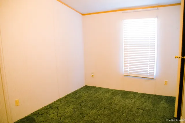 a view of a room that has a window in it