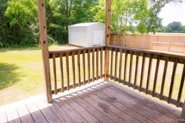a view of outdoor space with deck and yard