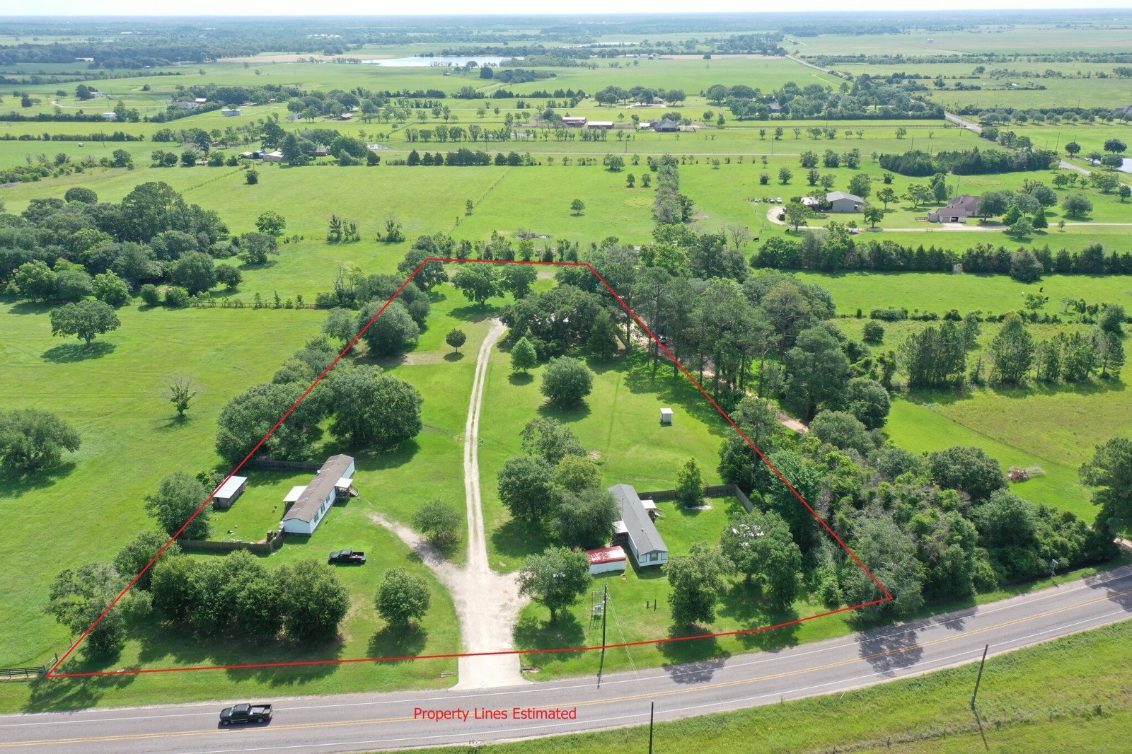 24106 Farm To Market 362 Waller, TX 77484 - Photo 7 of 41 an aerial view of green landscape with trees houses and lake view