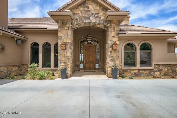 a view of a house with large windows
