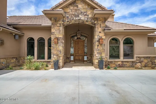 a view of a house with large windows