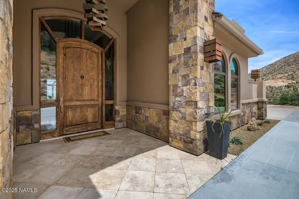 a view of a front door and outdoor space