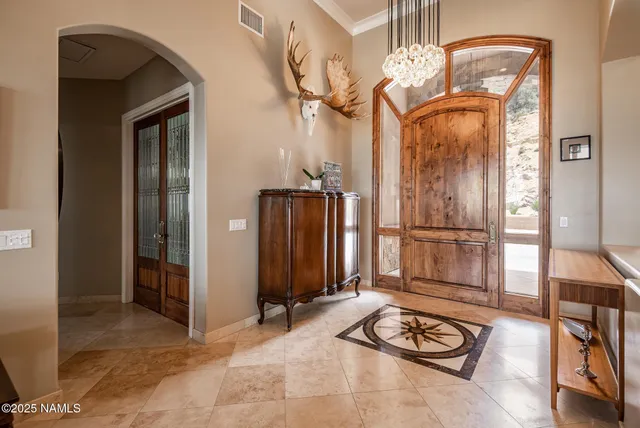a view of a hallway with wooden floor and door