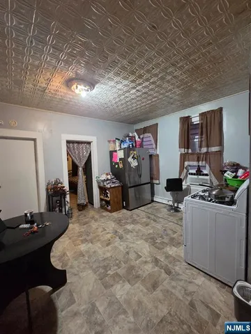 a room with furniture and a flat screen tv