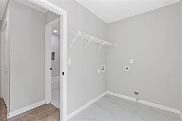 a white toilet sitting next to a bathroom sink