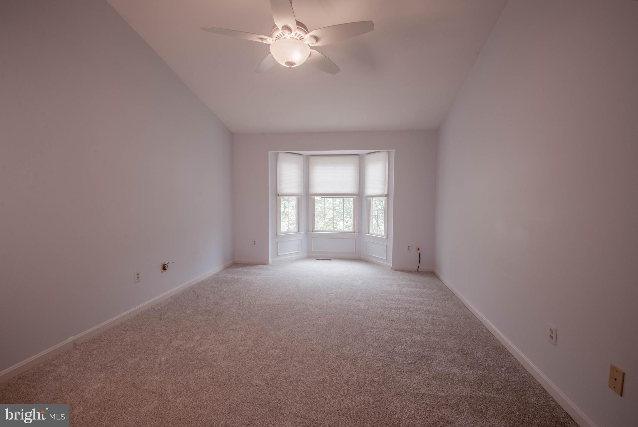 3206 Magnolia Ridge Road Annapolis, MD 21403 - Photo 21 of 43 Primary bedroom with bay window and ceiling fan