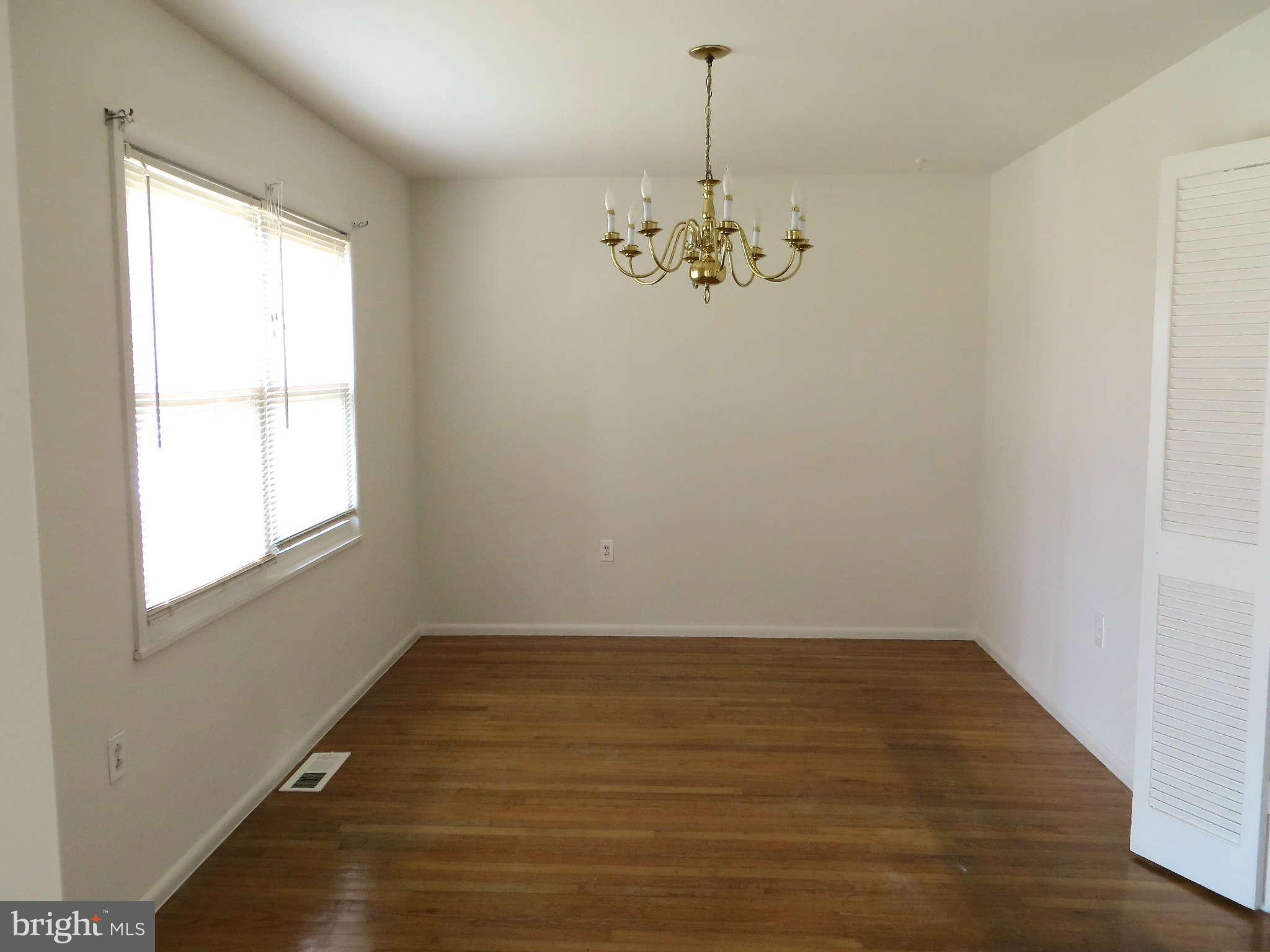 1942 Harewood Road Edgewood, MD 21040 - Photo 3 of 11 a view of wooden floor and a chandelier in a room
