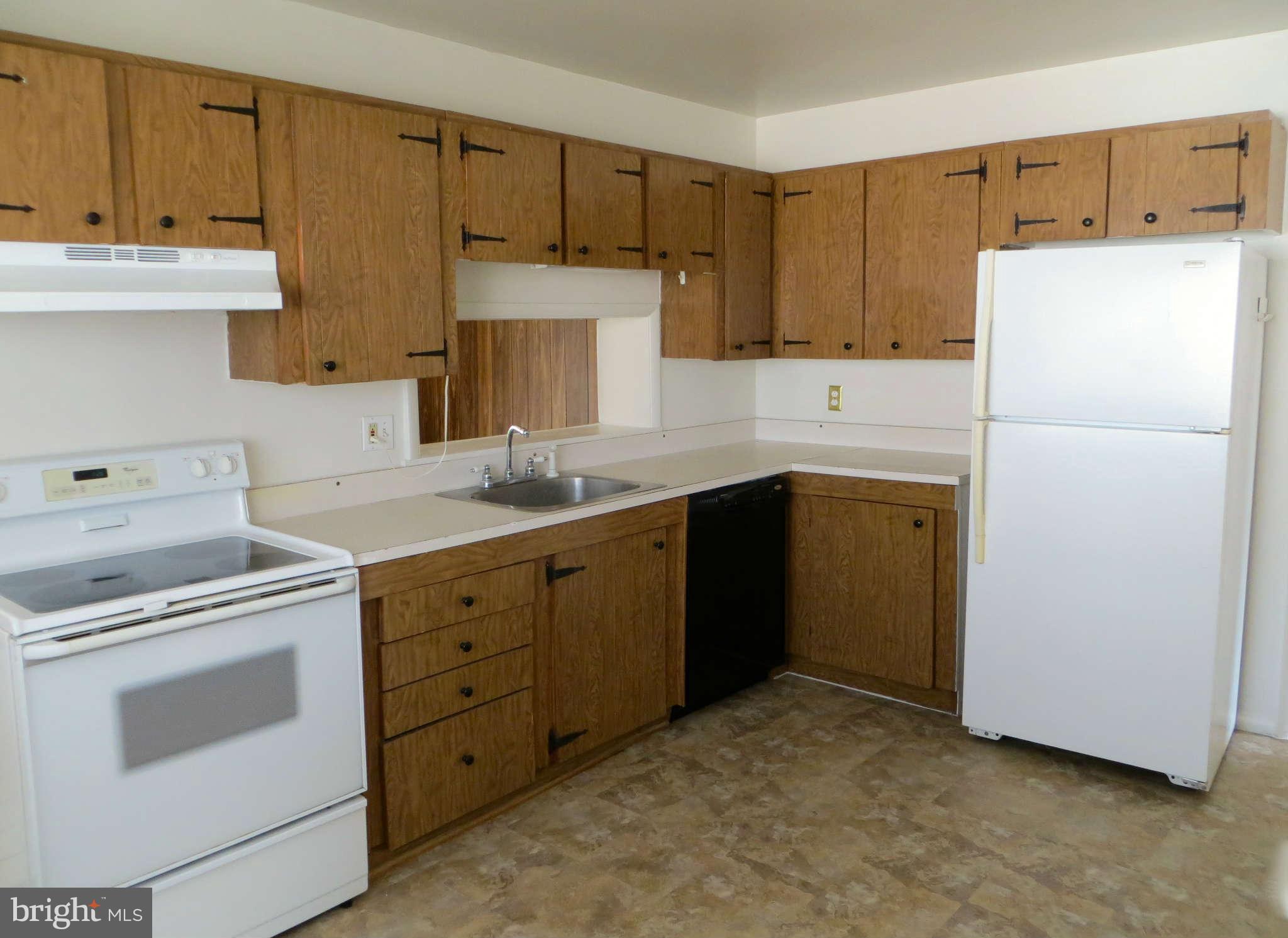 1942 Harewood Road Edgewood, MD 21040 - Photo 4 of 11 a kitchen with a sink stove and refrigerator