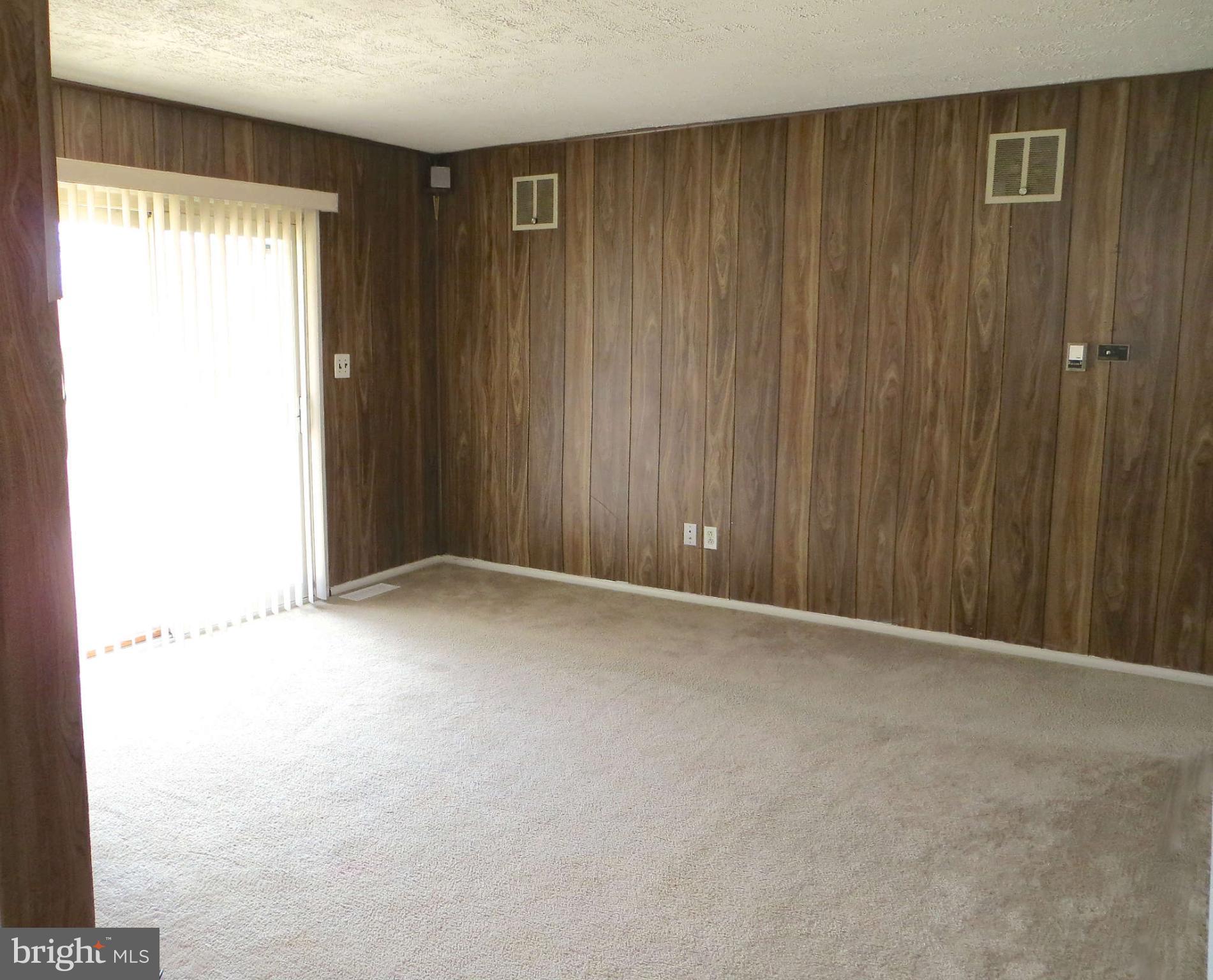 1942 Harewood Road Edgewood, MD 21040 - Photo 5 of 11 a view of an empty room with a window