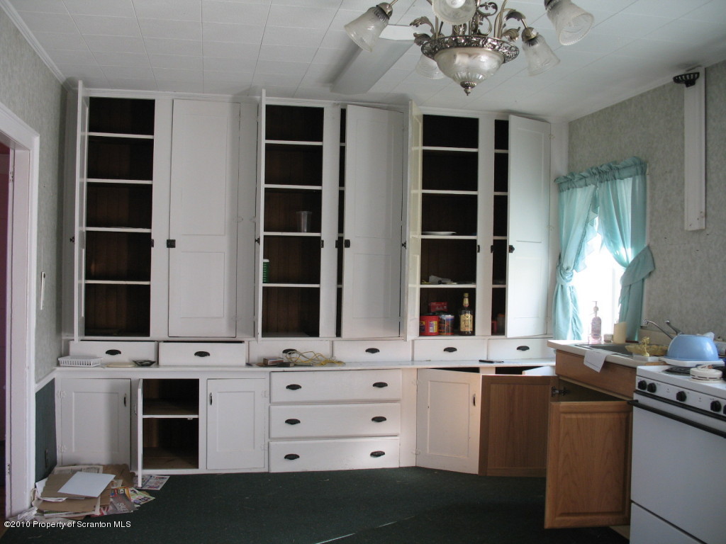 144 Savitz Road Moscow, PA 18444 - Photo 3 of 7 a room with a large window and a fireplace