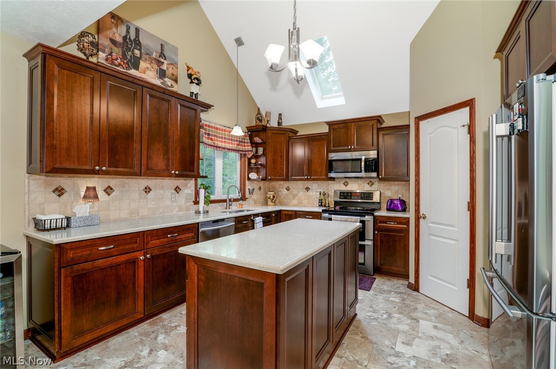 4490 Fenn Road Medina, OH 44256 - Photo 10 of 35 The updated kitchen offers cherry cabinetry, Quartz countertops a custom built, built-in wine bar, ceramic floors and newer appliances. The vaulted ceiling with a skylight and pantry are great features