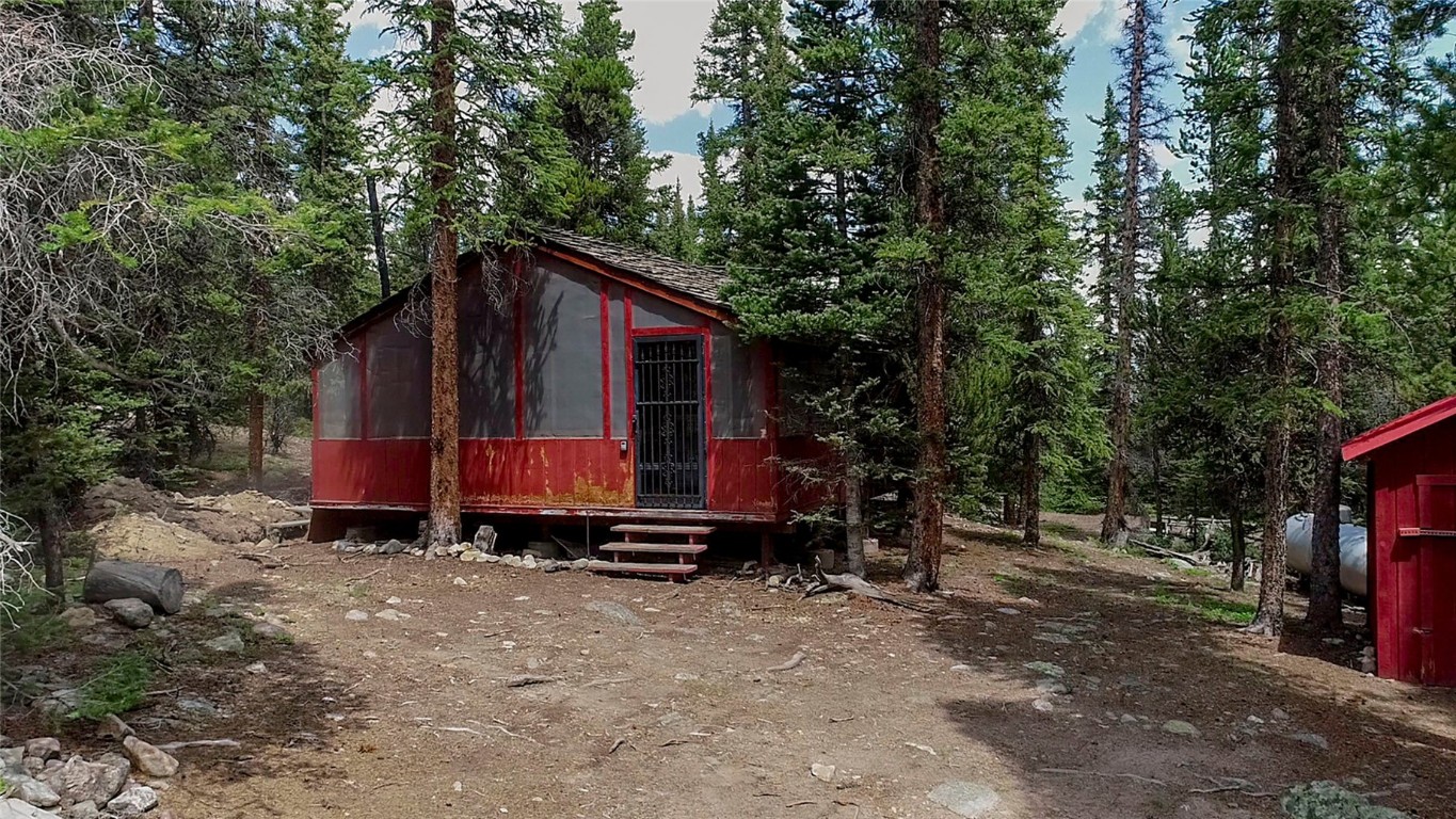 2190 Kootchie Kootchie Road Alma, CO 80420 - Photo 12 of 35 a view of a small house in the forest