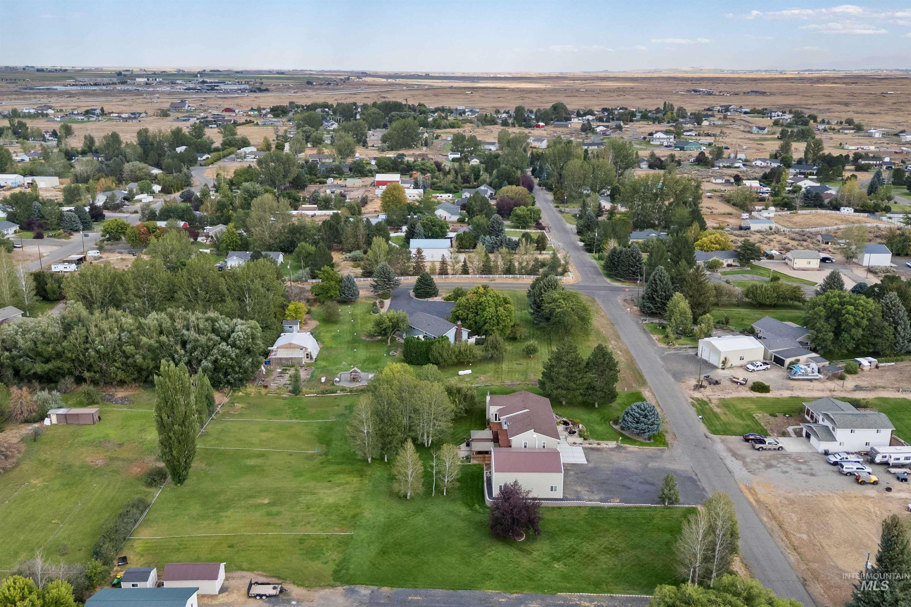 216 Ranch View Road West Jerome, ID 83338 - Photo 35 of 42 Aerial perspective showcasing a residential area with varied housing styles, established landscaping, and paved roadways