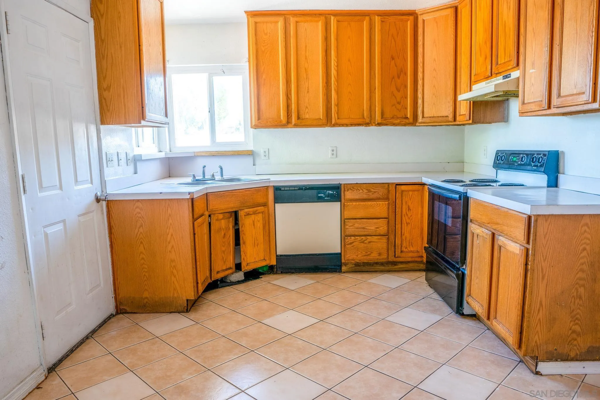 9209 Jamacha Boulevard Spring Valley, CA 91977 - Photo 15 of 26 a kitchen with stainless steel appliances granite countertop a refrigerator and a sink