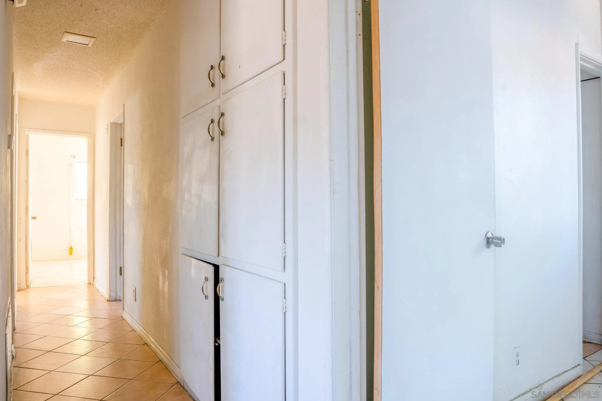 9209 Jamacha Boulevard Spring Valley, CA 91977 - Photo 18 of 26 a view of a hallway with a door and the front door