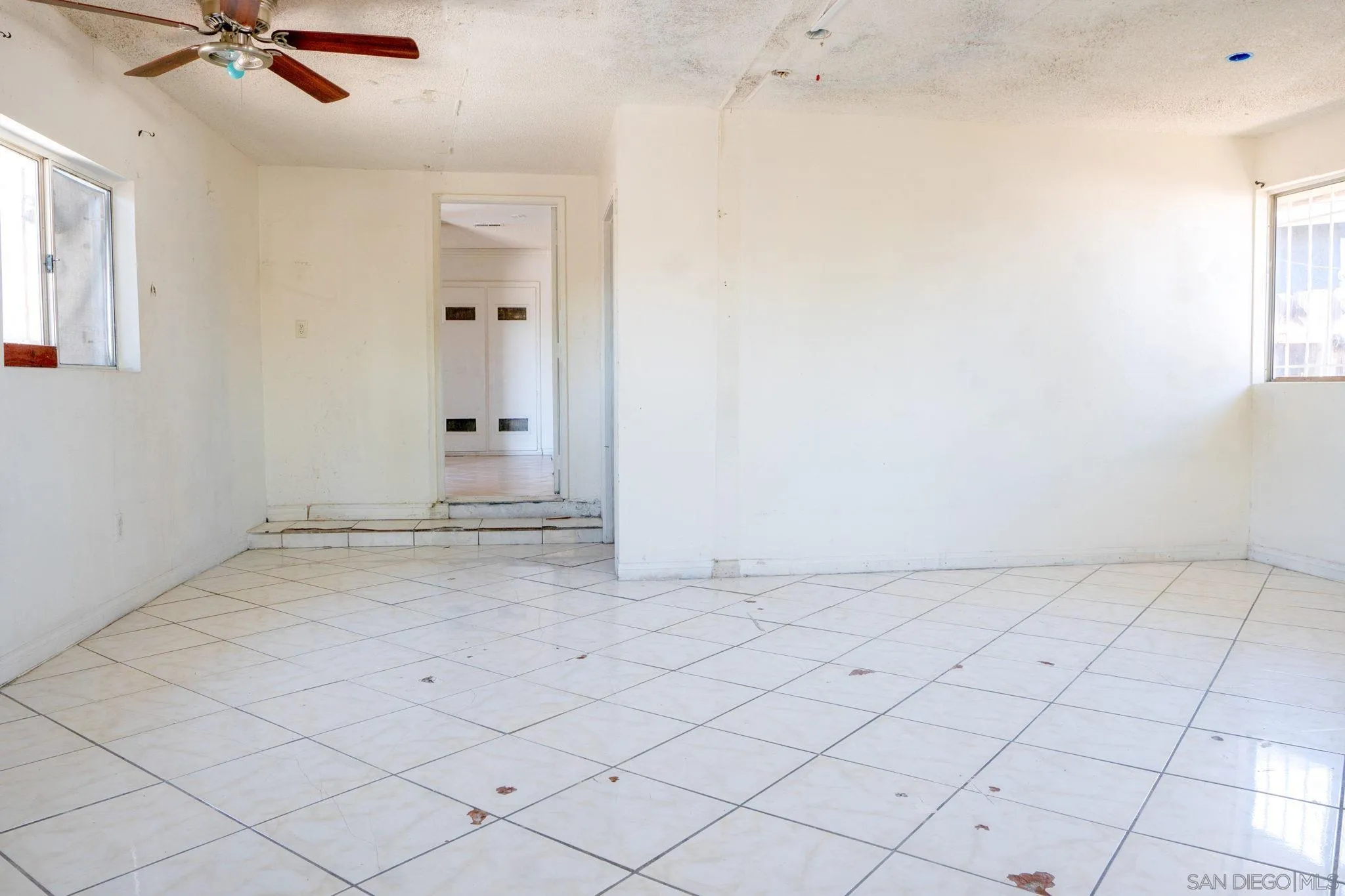 9209 Jamacha Boulevard Spring Valley, CA 91977 - Photo 10 of 26 an empty room with a empty space and windows