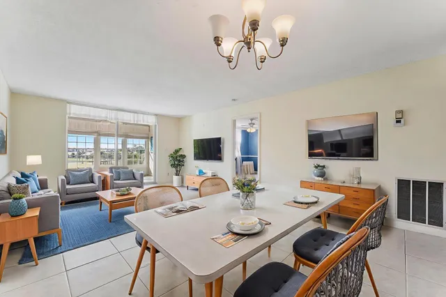 a view of a dining room with furniture window and outside view