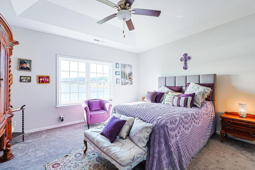 2821 Rivolet Drive Conway, SC 29526 - Photo 11 of 34 Carpeted bedroom featuring a raised ceiling and a ceiling fan