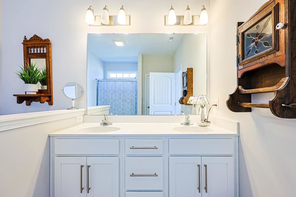 2821 Rivolet Drive Conway, SC 29526 - Photo 14 of 34 Bathroom with double vanity and a shower with curtain