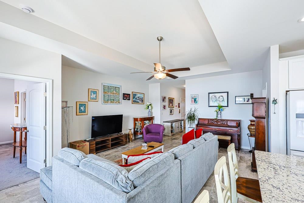 2821 Rivolet Drive Conway, SC 29526 - Photo 2 of 34 Living area with ceiling fan and a tray ceiling