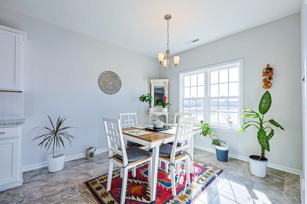 2821 Rivolet Drive Conway, SC 29526 - Photo 9 of 34 Dining area with baseboards and a chandelier