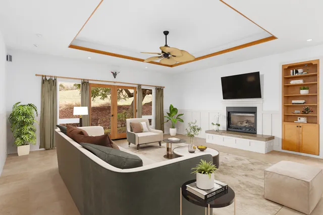 a bedroom with a bed and ceiling fan