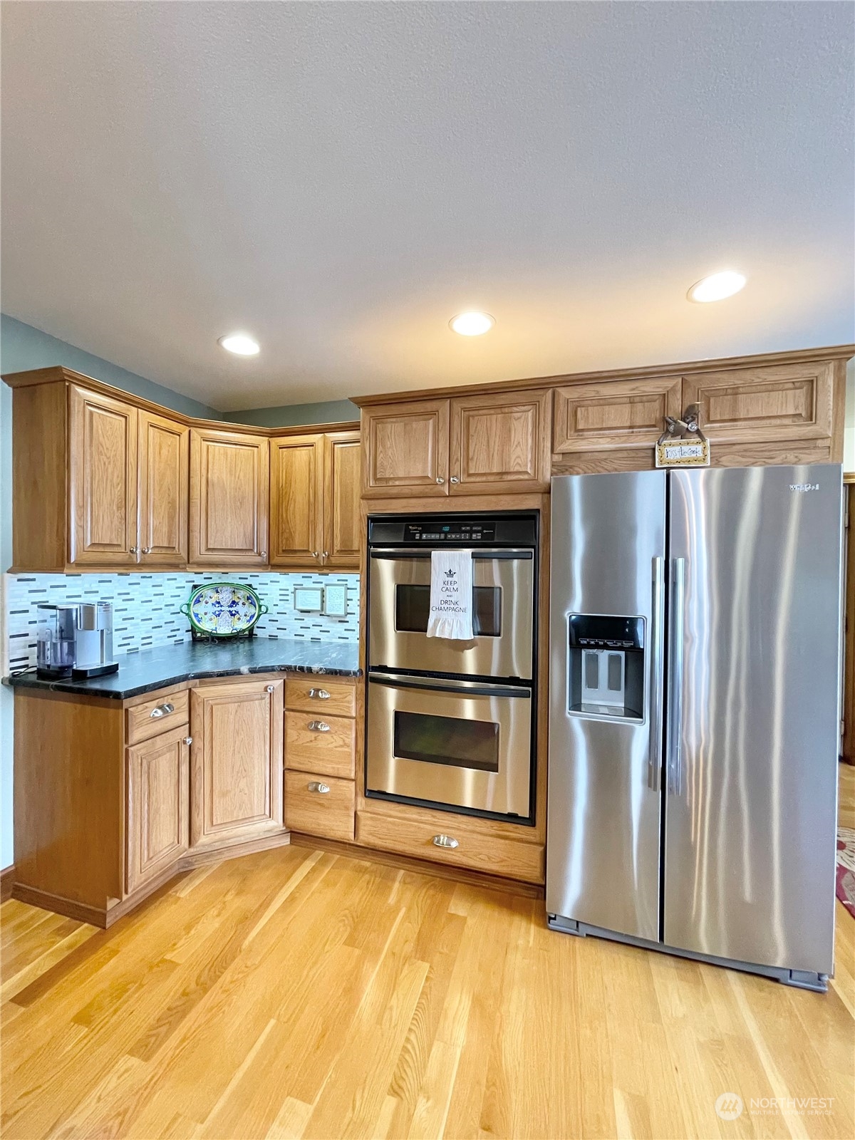 14 Pogue Road Okanogan, WA 98840 - Photo 16 of 40 a kitchen with stainless steel appliances granite countertop a refrigerator and a sink