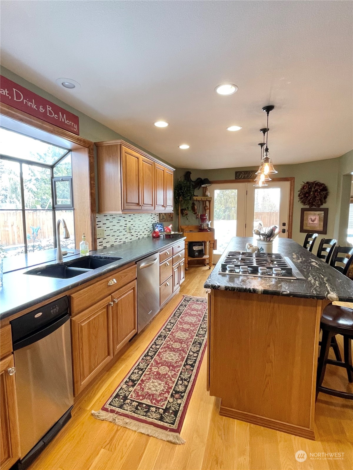 14 Pogue Road Okanogan, WA 98840 - Photo 18 of 40 a large kitchen with stainless steel appliances granite countertop a stove and a sink