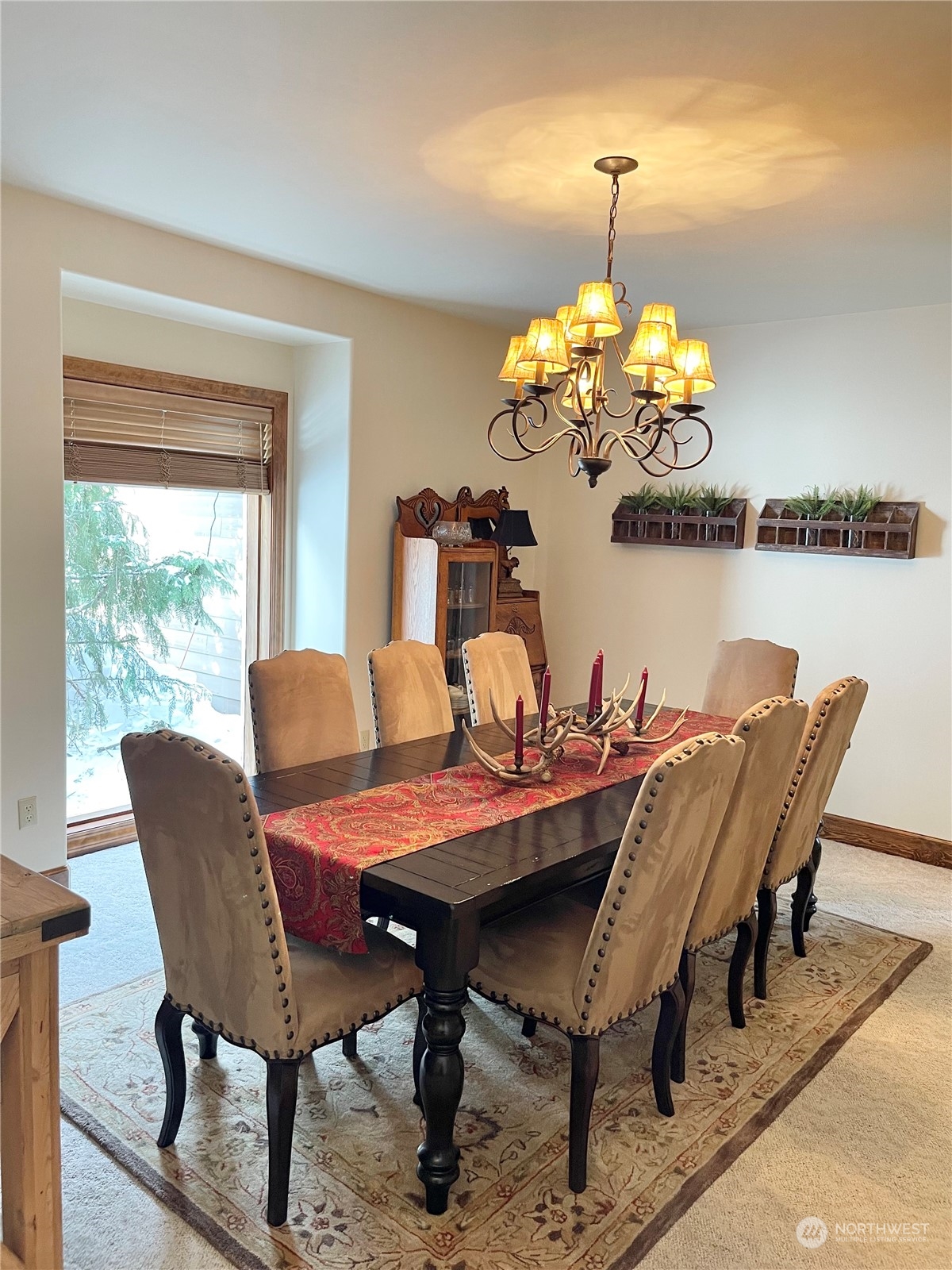 14 Pogue Road Okanogan, WA 98840 - Photo 21 of 40 a view of a dining room with furniture a chandelier and wooden floor