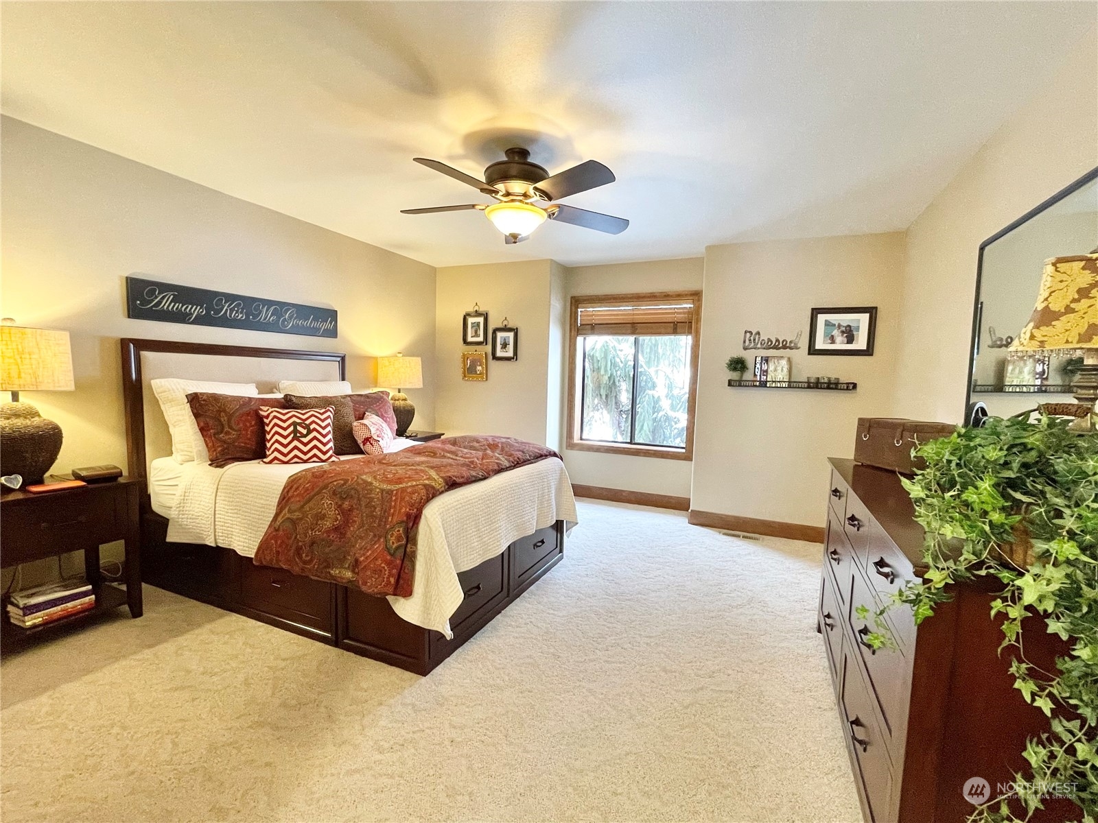 14 Pogue Road Okanogan, WA 98840 - Photo 23 of 40 a bedroom with a large bed chandelier and a window