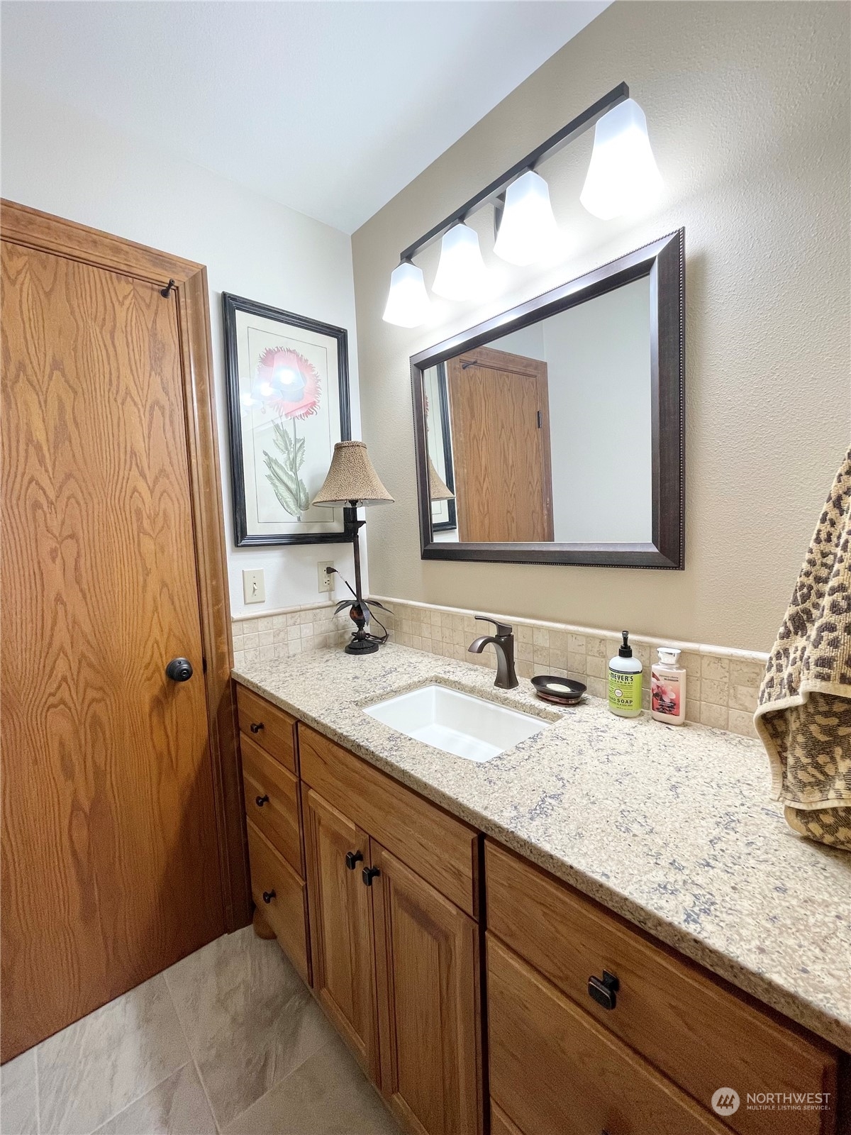 14 Pogue Road Okanogan, WA 98840 - Photo 35 of 40 a bathroom with a double vanity sink and a mirror