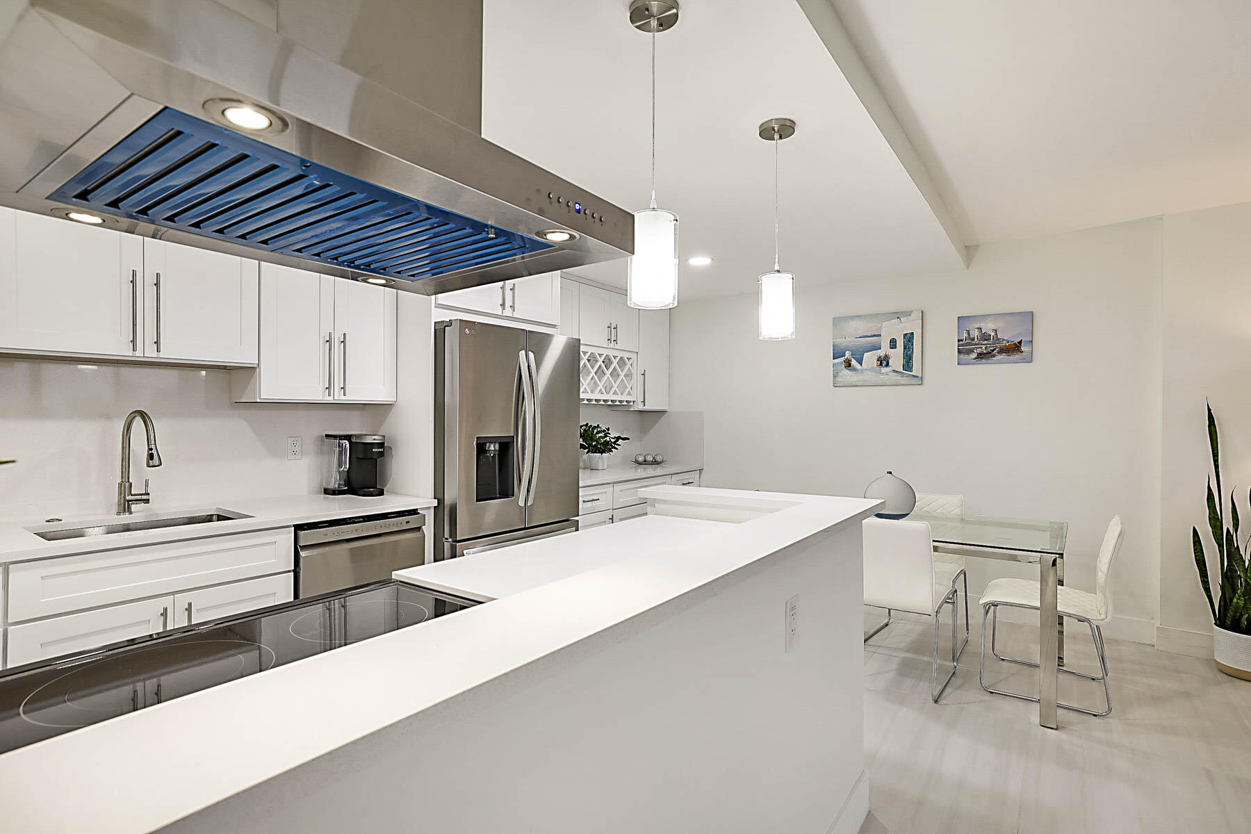 2121 North Ocean Boulevard, Unit 806W Boca Raton, FL 33431 - Photo 12 of 63 a kitchen with a sink cabinets and window