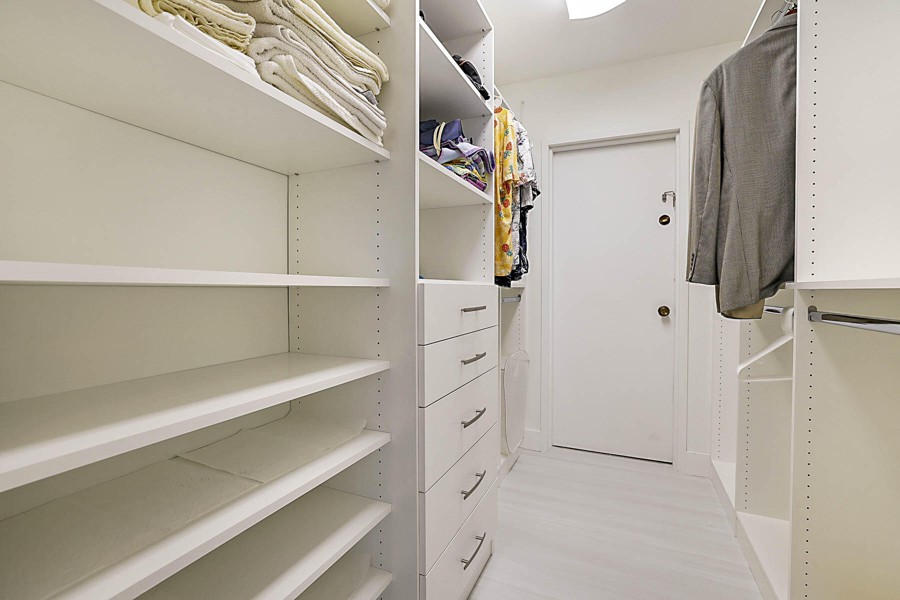 2121 North Ocean Boulevard, Unit 806W Boca Raton, FL 33431 - Photo 24 of 63 a view of walk in closet with empty racks