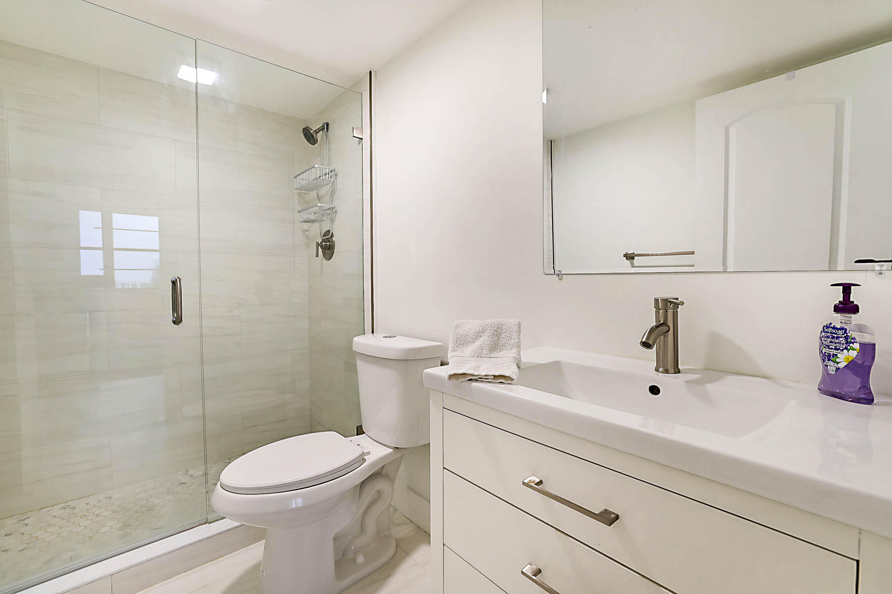 2121 North Ocean Boulevard, Unit 806W Boca Raton, FL 33431 - Photo 25 of 63 a bathroom with a sink a toilet and shower