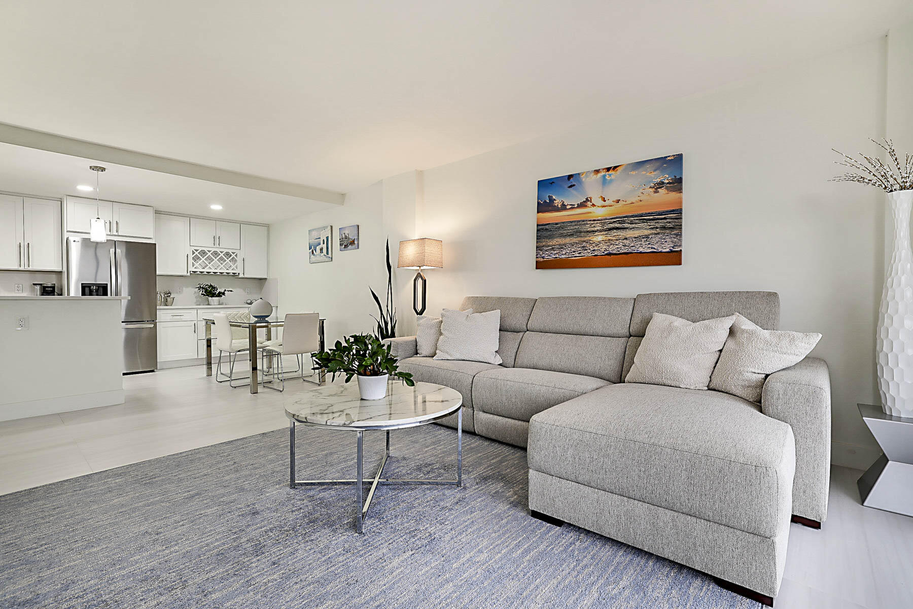 2121 North Ocean Boulevard, Unit 806W Boca Raton, FL 33431 - Photo 63 of 63 a living room with furniture and kitchen view