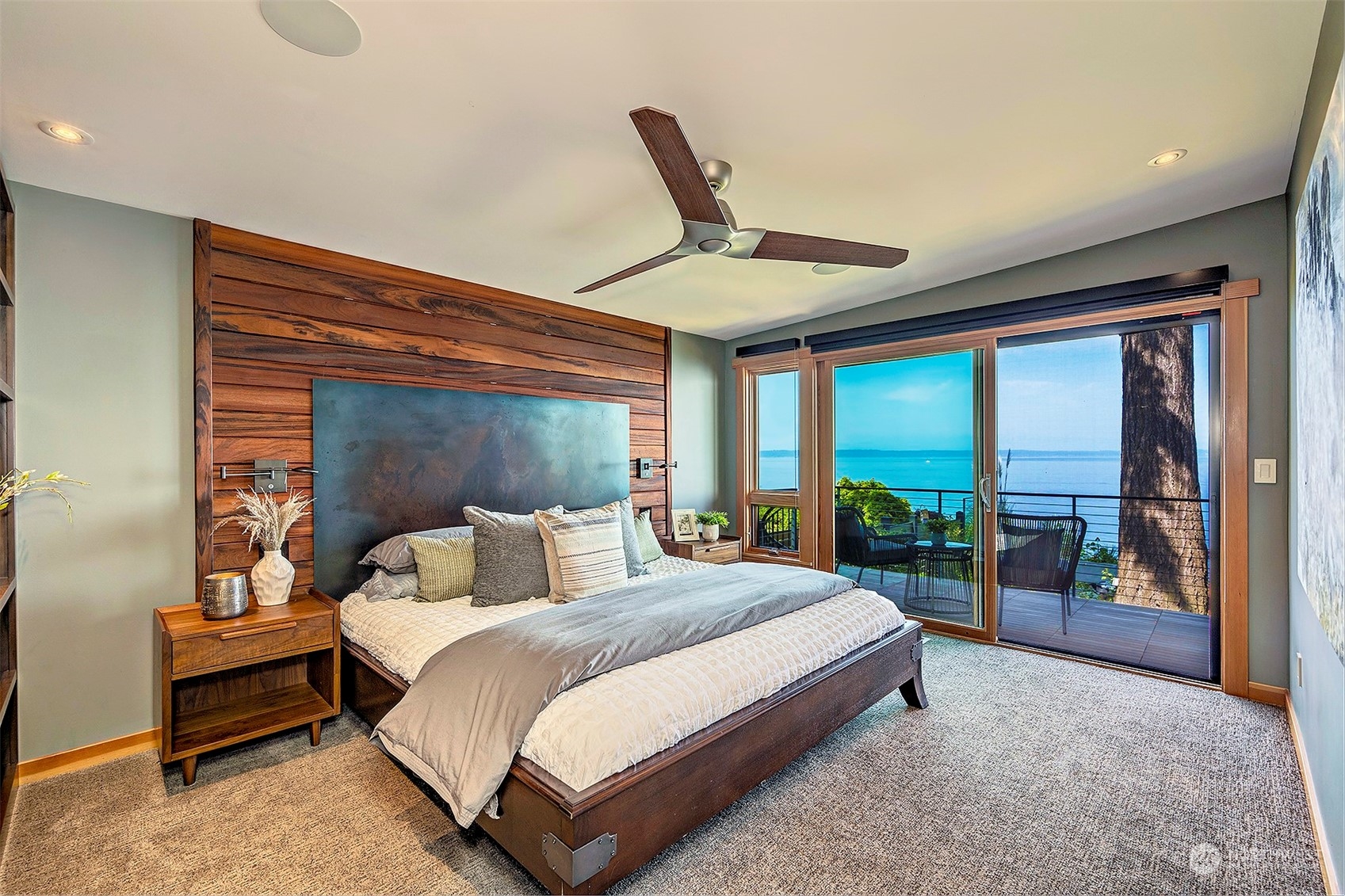 16902 Talbot Road Edmonds, WA 98026 - Photo 14 of 38 a bedroom with a large bed and a large window