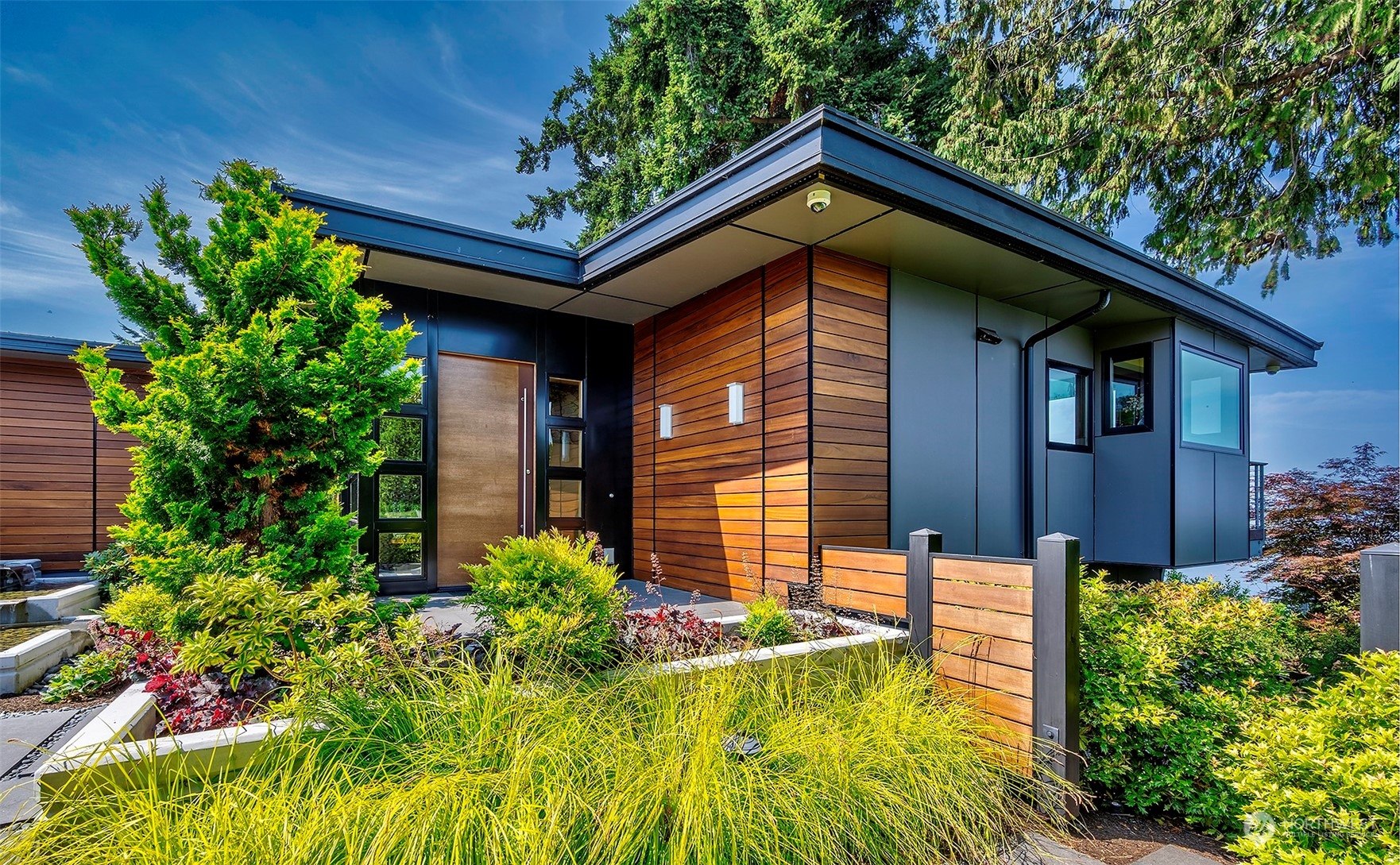 16902 Talbot Road Edmonds, WA 98026 - Photo 2 of 38 a front view of a house with garden