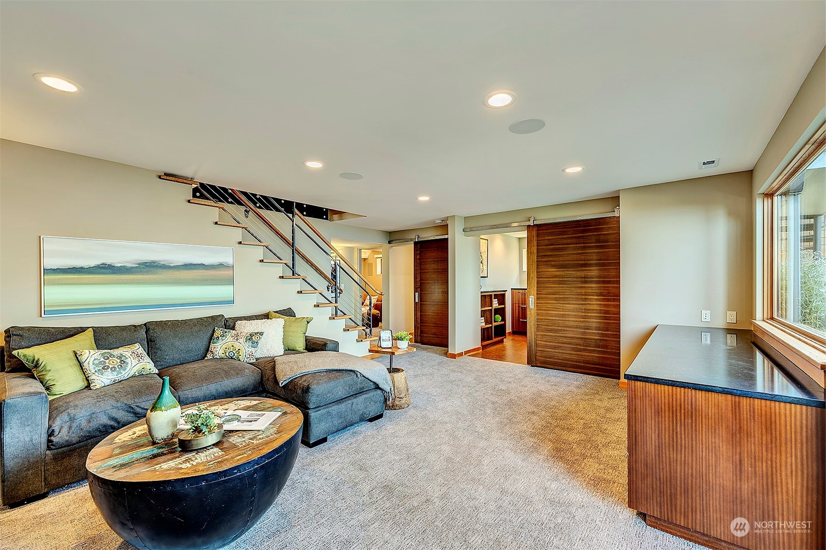 16902 Talbot Road Edmonds, WA 98026 - Photo 22 of 38 a living room with furniture and a large window